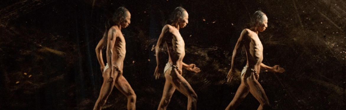 A triple-image of a Butoh dancer in a fundoshi (loin cloth), walking against a dark mottled background. Image credit: Jordi Lagoutte.