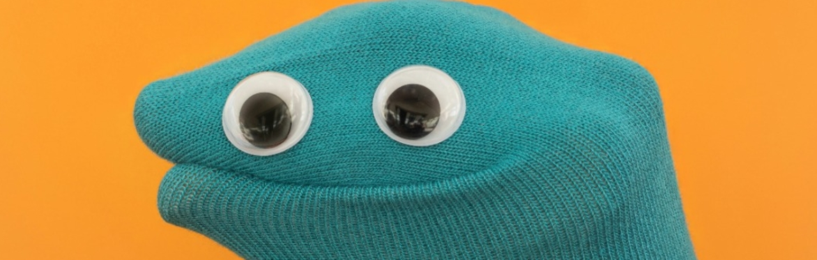 a hand puppet with eyes
