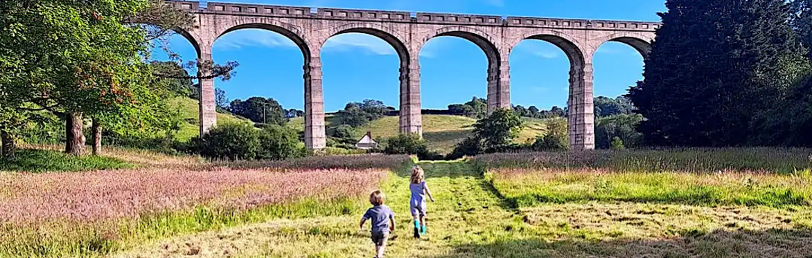 Children running towards Cannington Viaduct