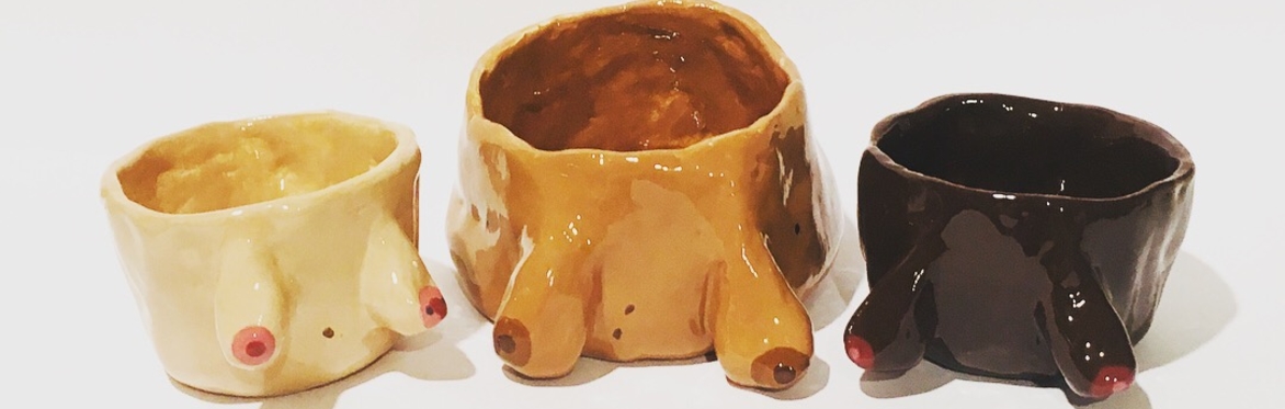 Image of guest pottery painting a bowl in a creative class