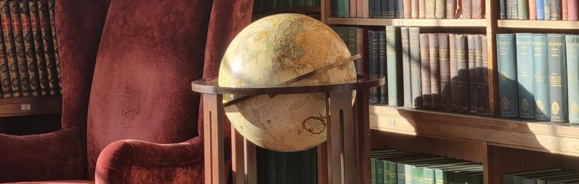 Globe with books and chair