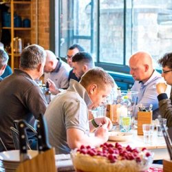 People sitting at a table eating together