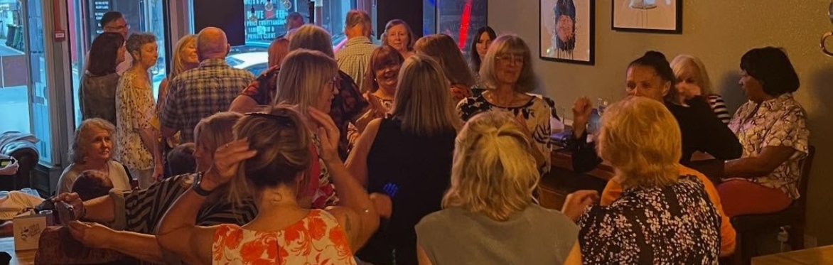 Crowd of people having fun dancing at Sheldons Daytime Disco
