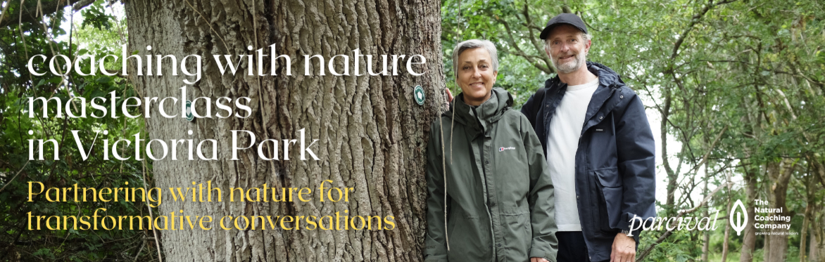 two people karen leibenguth and james farrell standing smiling by oak tree