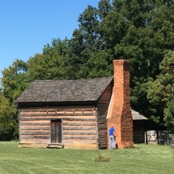 Log cabin in a clearing