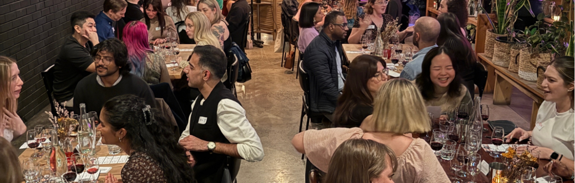 People talking over glasses of wine