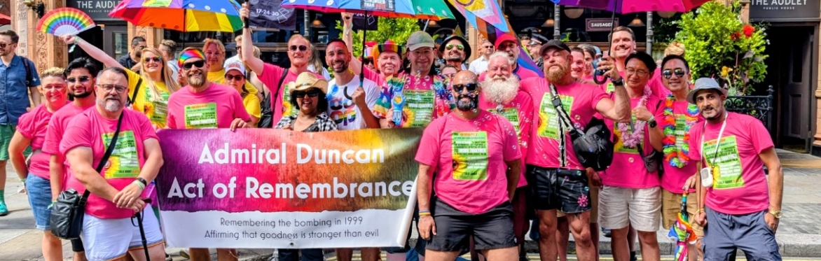 Lovely group of people standing with the Admiral Duncan Memorial Banner