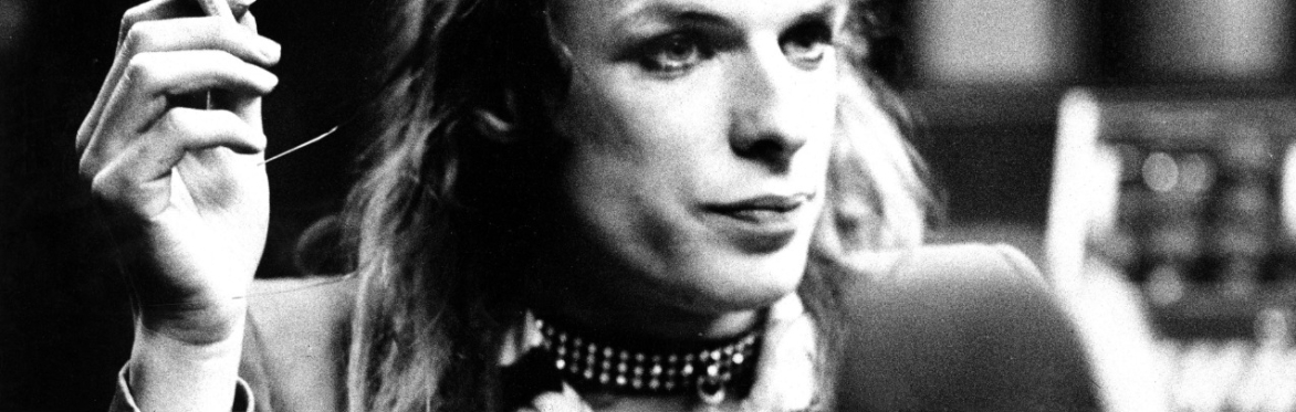 Brian Eno in makeup, looking glam even with thinning hair.