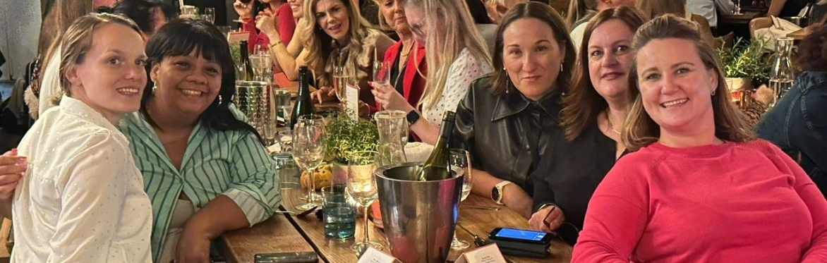 Ladies sat around table at networking event