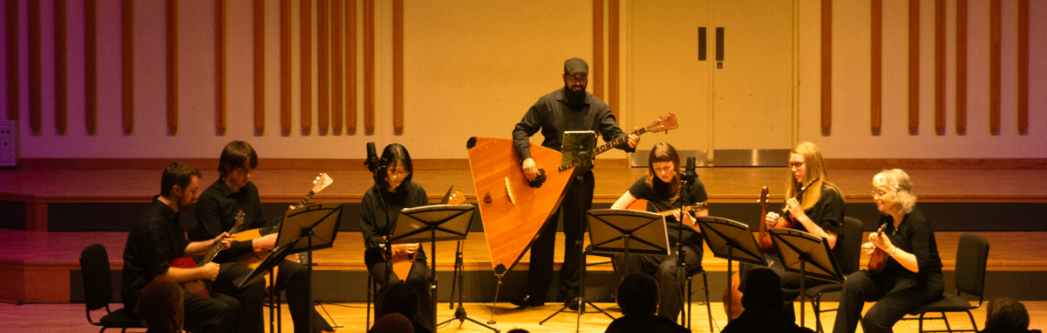 Musicians playing balalaika and domra instruments