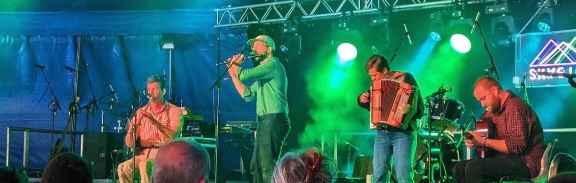 FRAS band on stage playing instruments