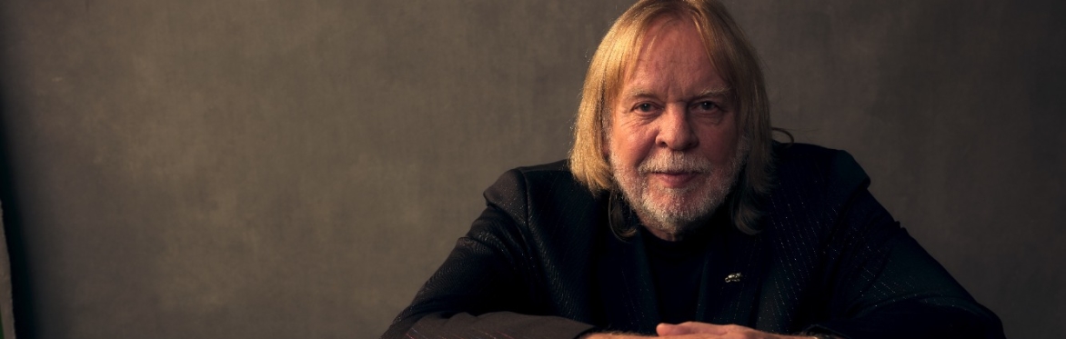 Christmas concert banner with Rick Wakeman inside a Christmas bauble and church inside a bauble