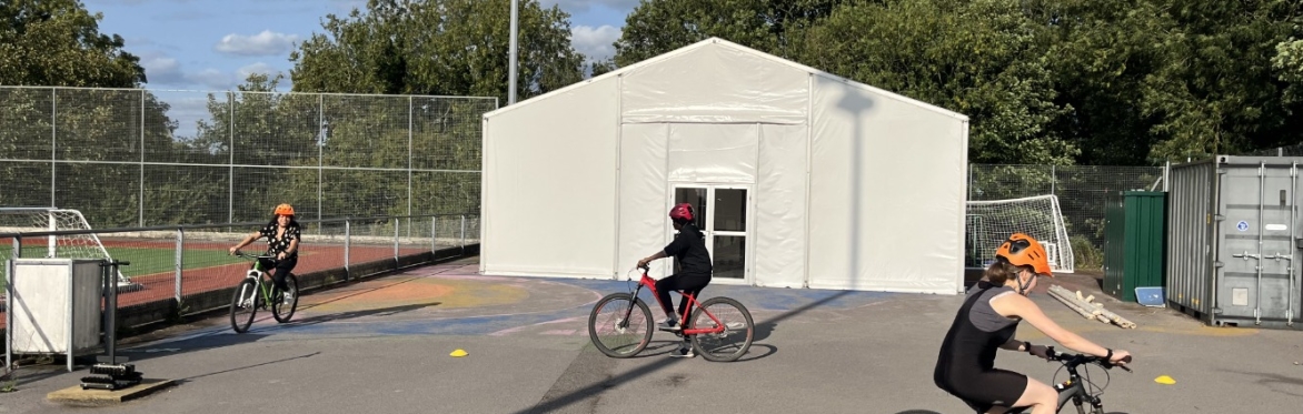 Beginner cyclists learning to ride a bike