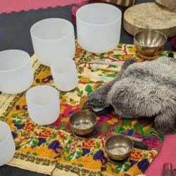 Crystal singing bowls of various sizes ( all in the healing frequency of 432hz), native flute skin drums, koshi chimes and Tibetan singing bowls arranged to be played