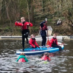 Children on MEGA SUP on the lake