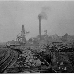 Black and white photo from inside a train wagon looking at Lumpsey Mine.