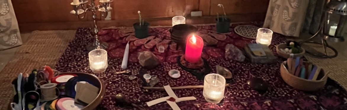 altar with candles and witches tools