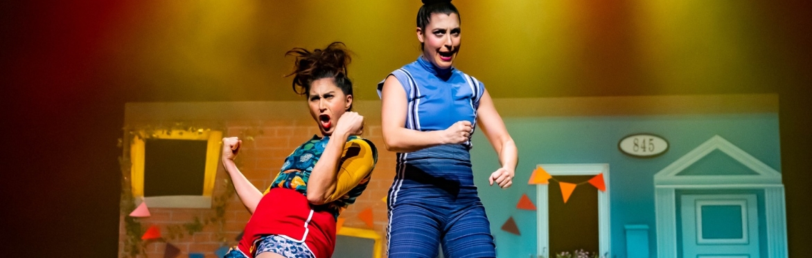 Vana and Huguette pose on stage.