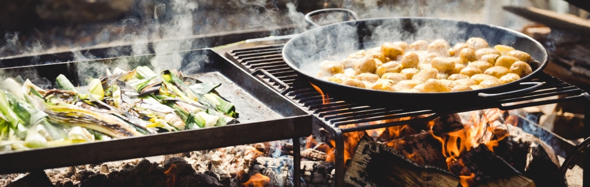 Potatoes and leeks cooking over fire