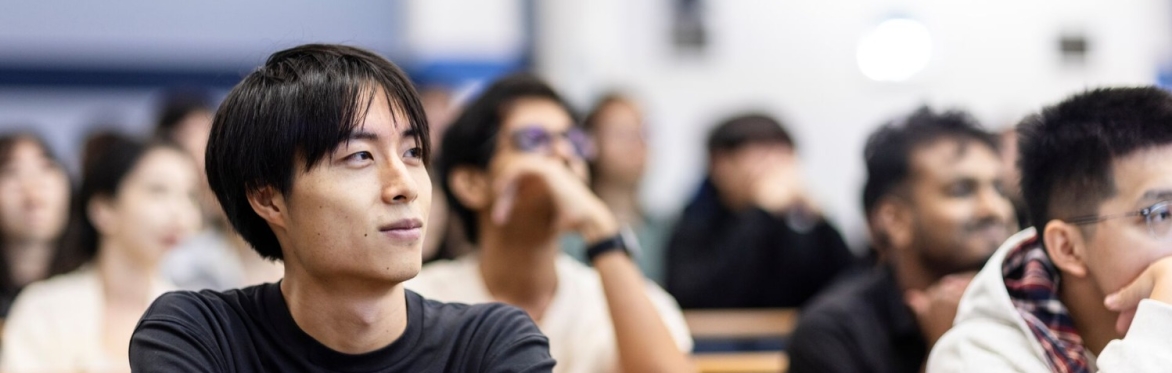 Student seated in lecture theatre