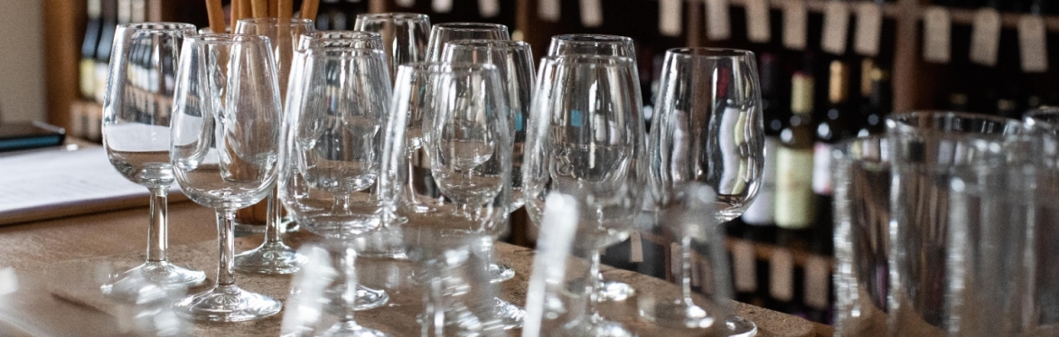 wine glasses with bottle in the background