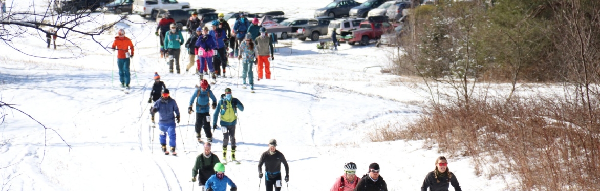 Skiers going uphill.