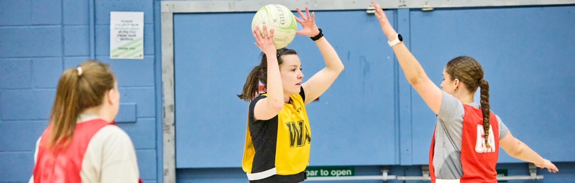 Student learn to play netball