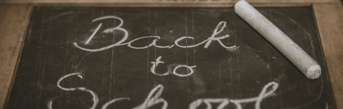 a slate with the words 'back to school'