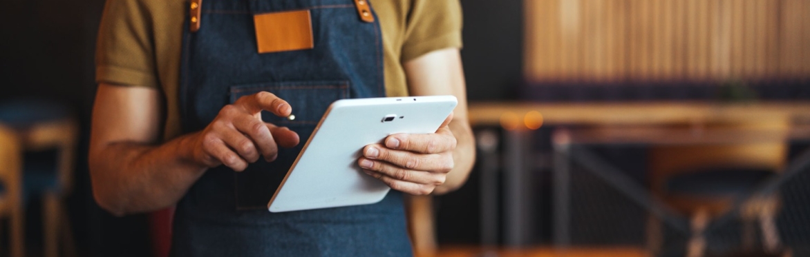 Restaurant worker using tablet
