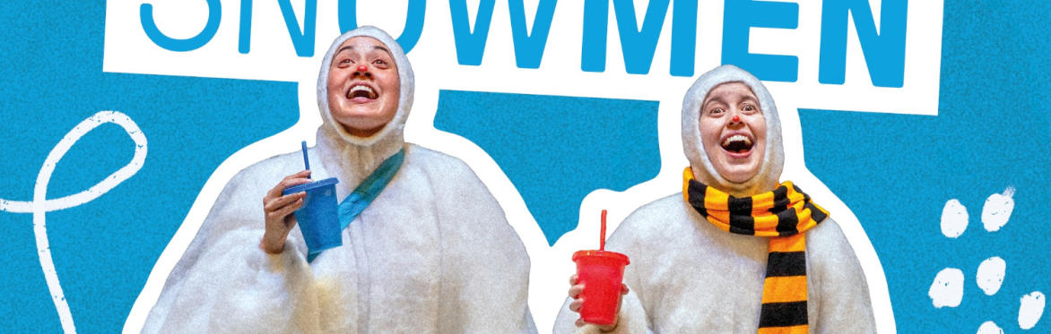 Two performers in clown make-up dressed as snowmen in white fluffy onesies.