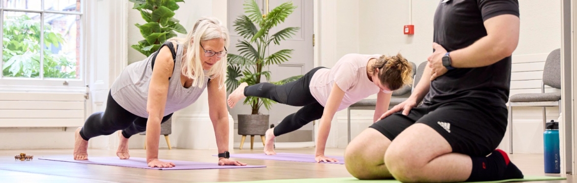 Participants in plank position taking part in Active campus Calisthenics class