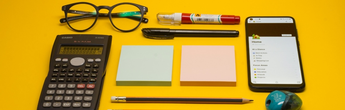 A selection of accounting-related objects on a yellow background