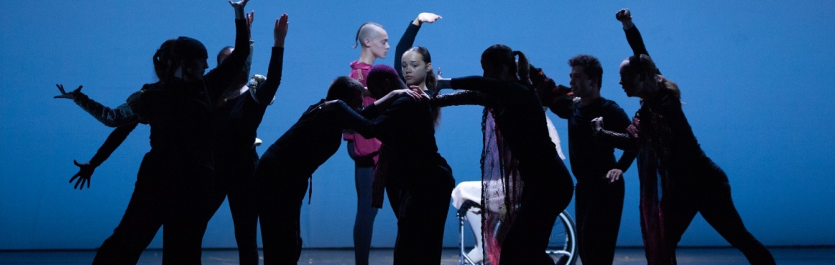 Image features NYB All In! participants dancing Ballet in a light studios with floor length windows.