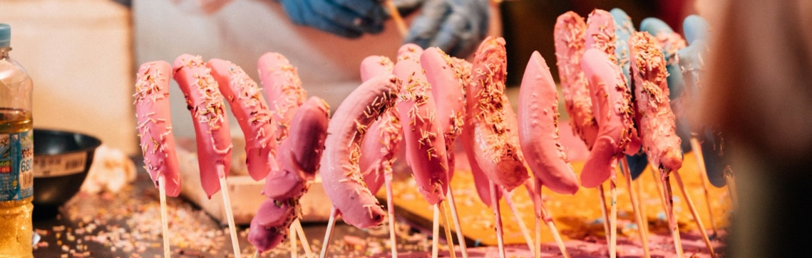 People making chocolate bananas