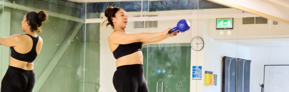 Instructor leading an Active Campus Legs, Bums and Tums class