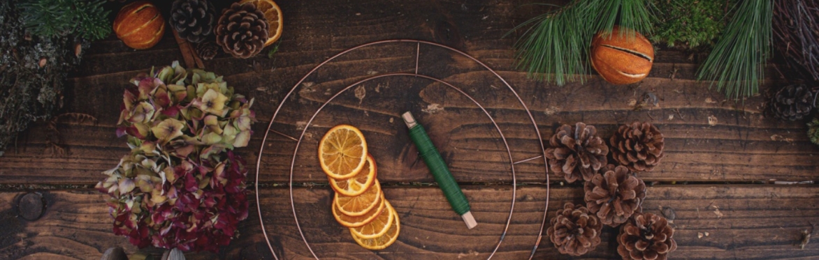 a table with items to create a Christmas wreath