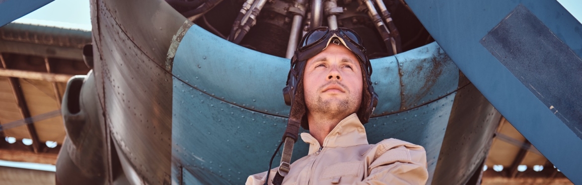 Man stood by airplane propeller