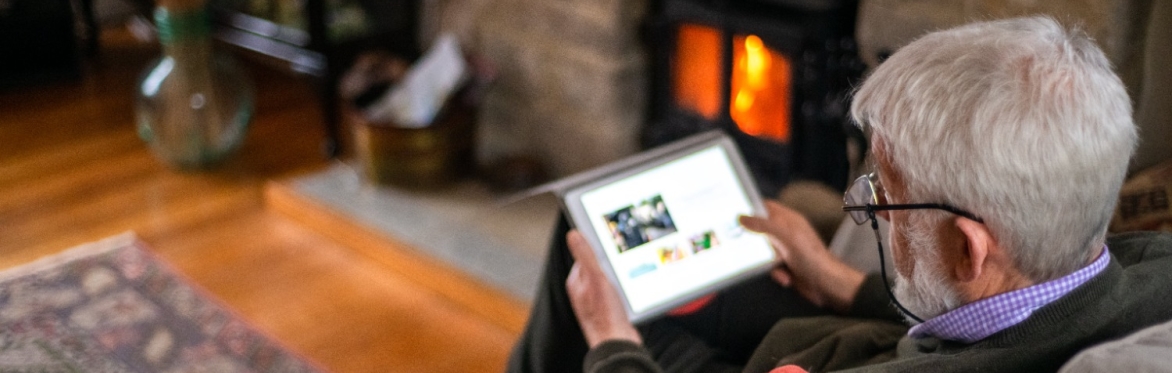 A couple sitting in front of a laptop