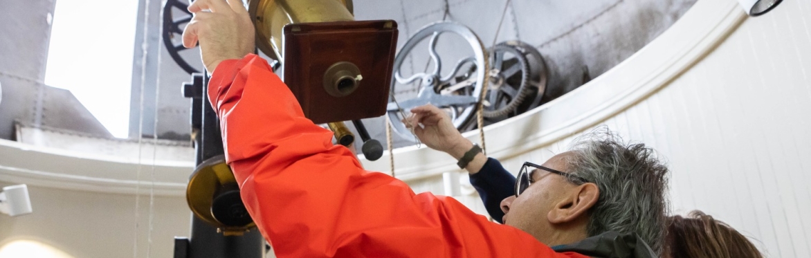 A view of a volunteer operating the Cooke Telescope