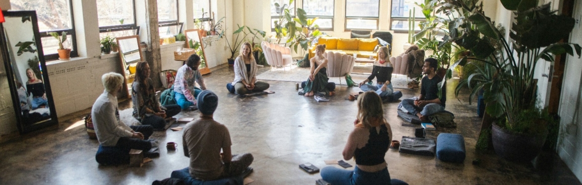 https://unsplash.com/photos/a-group-of-people-sitting-in-a-circle-in-a-room-ciqbTWuGgBI