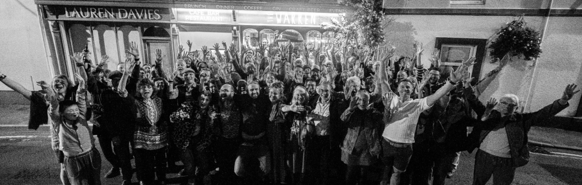 Group of people celebrating outside the warren in carmarthen