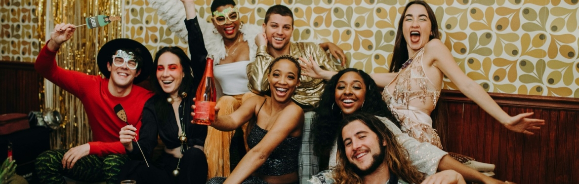 Group of diverse people on a couch having fun