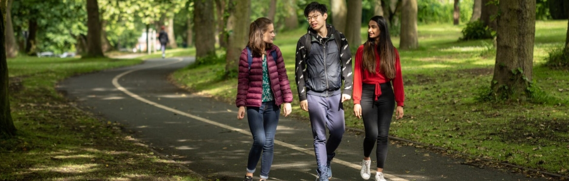 3 students walking in Woodhouse Moor