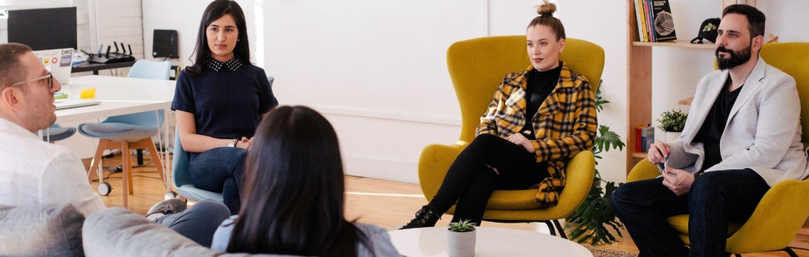 People sitting in a circle for a meeting
