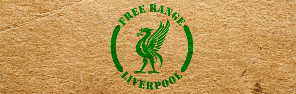 A printed logo in green printed onto cardboard. The logo is a roundel that features Liverpool's Liver Bird in its centre surrounded by the text Free Range Liverpool