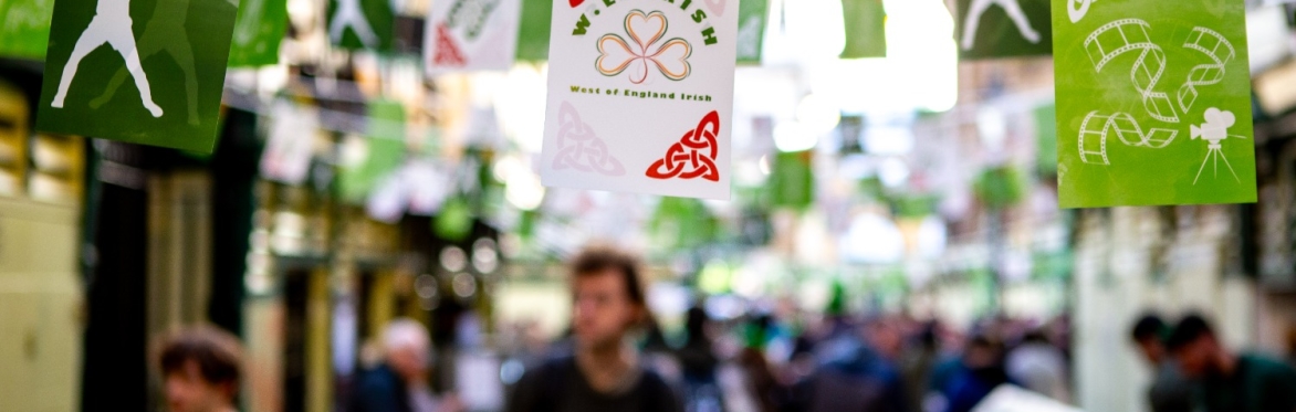 this is an image of bunting hanging in a marketplace that has the words WE Irish on it