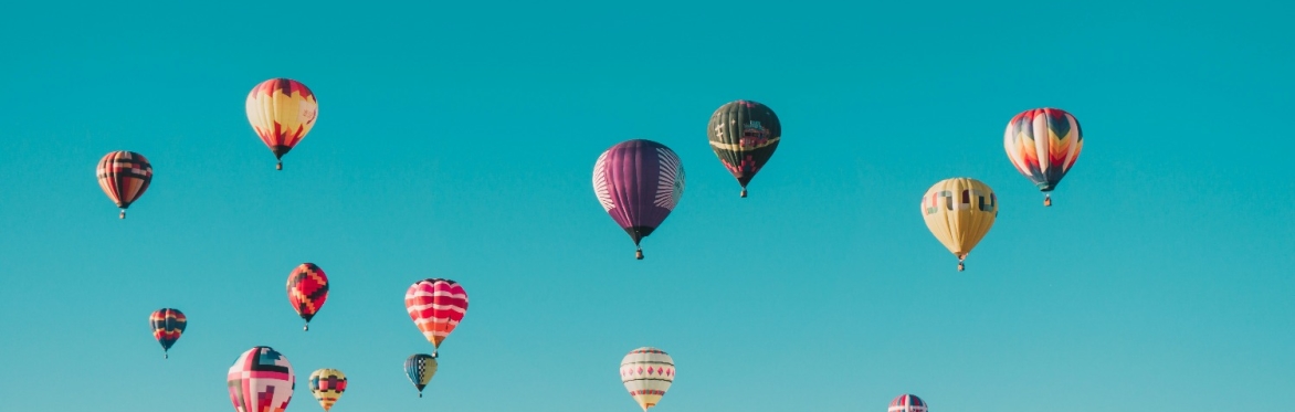 Hot air balloons in a blue sky