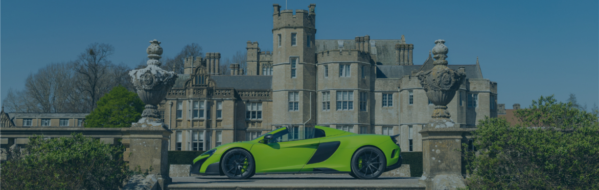 Green McLaren in front of Canford School