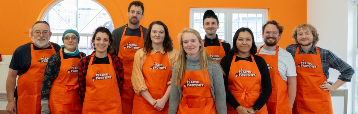 group of Fixing Factory team smiling at camera