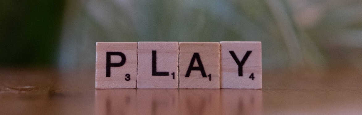 4 game tiles spell out the word PLAY